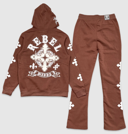 Back of brown hoodie and jogger set with large white cross and 'Rebel Minds' graphic design, decorated with white puzzle piece patterns throughout.