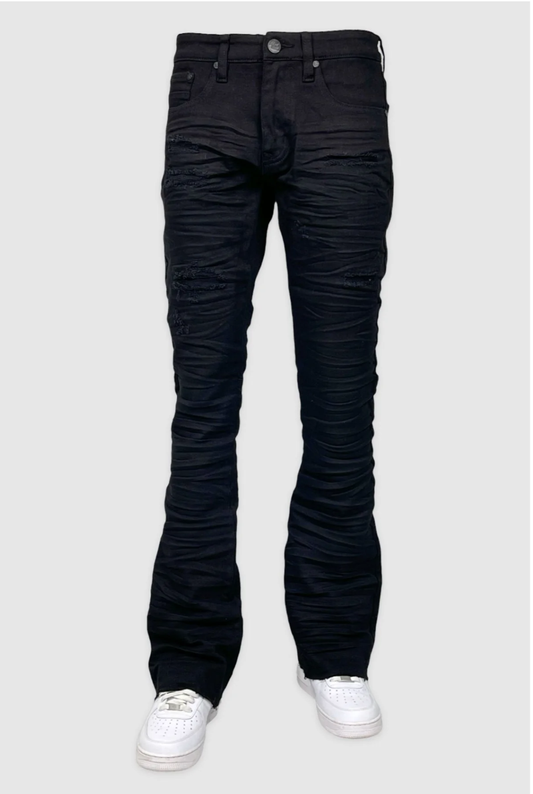Black stacked jeans with ripped knee and ruched leg