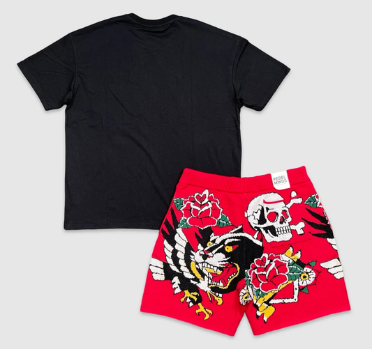 Back view of black Rebel t-shirt with plain design, paired with red knit shorts featuring bold skull, rose, and panther graphics.