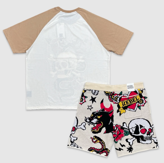 Back view of Two-piece Rebel Minds outfit with beige and white graphic t-shirt featuring skull, roses, and snake design, paired with cream knit shorts decorated with panther, skull, rose, snake, and heart graphics
