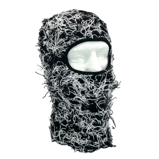 Black and white knitted balaclava on a white background