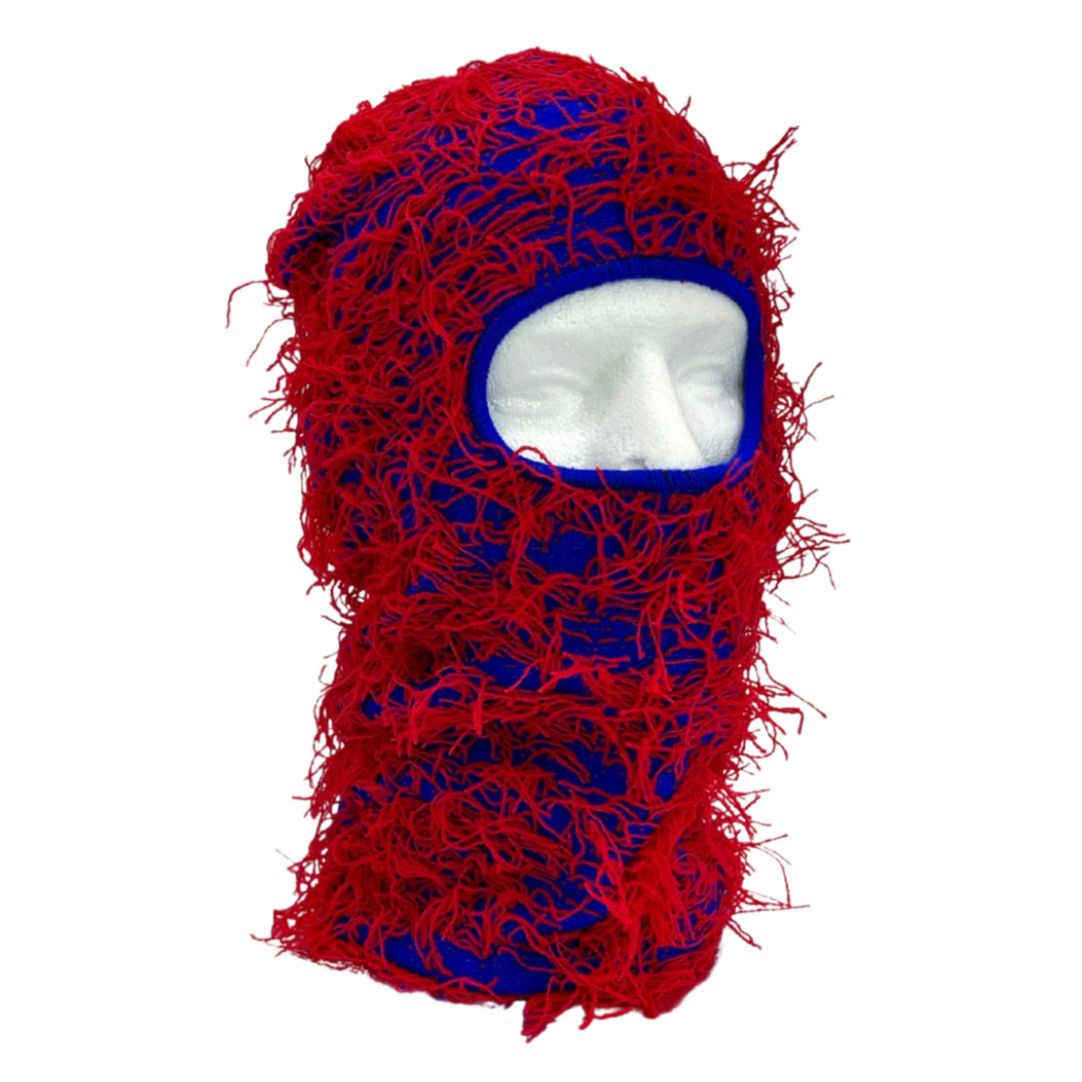 Red and blue knitted balaclava on a white background