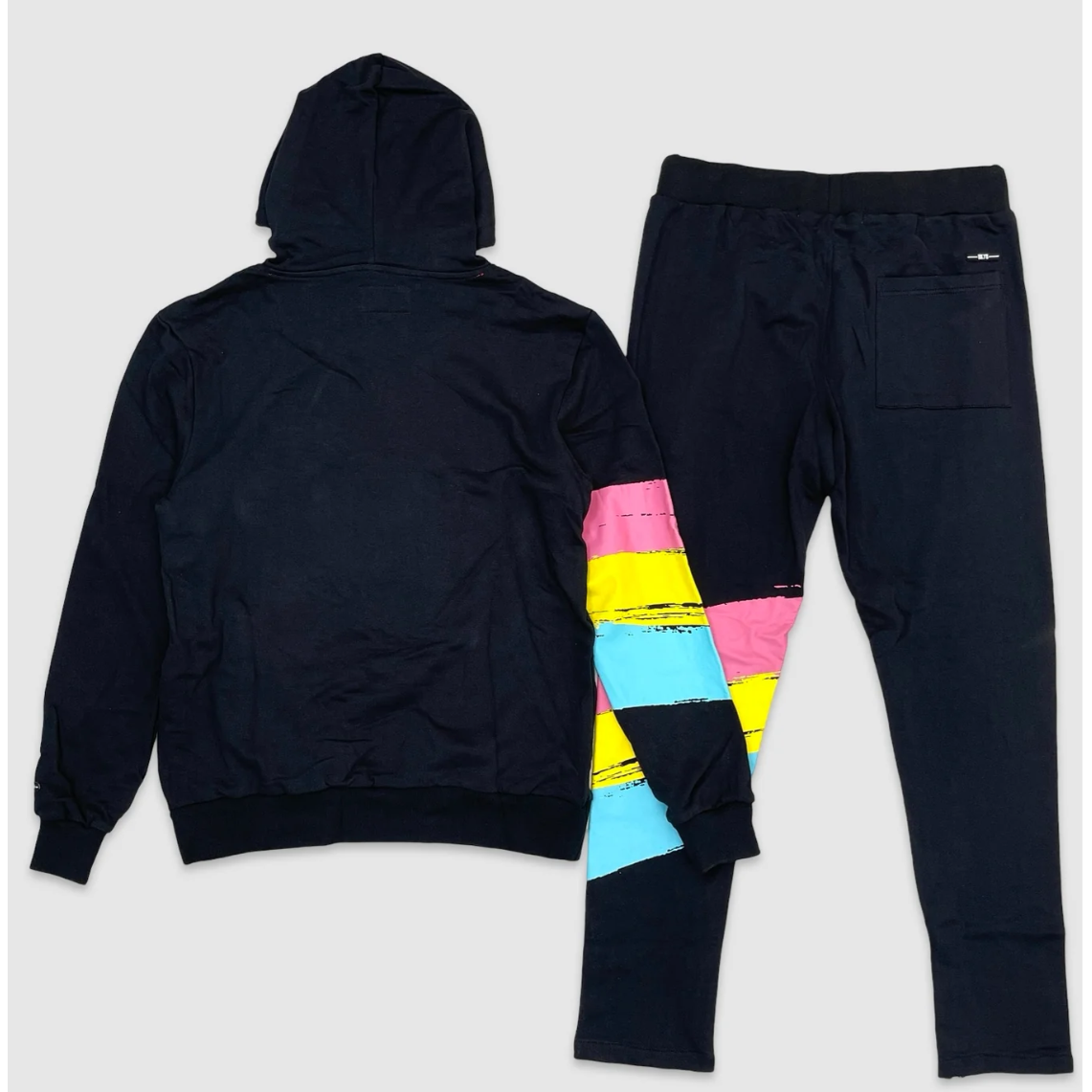 Back of blue hoodie and jogger set with colorful graffiti-style skull graphic, neon pink, yellow, and blue paint stripe accents, and bold text 'Don’t Think Twice' – urban streetwear tracksuit.