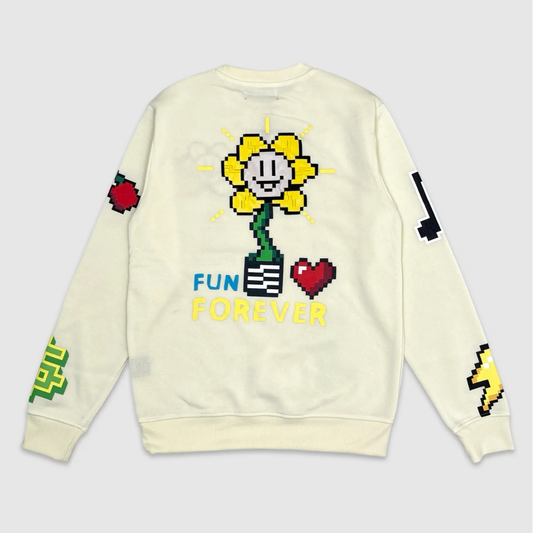 Beige crewneck sweatshirt with large pixel art yellow flower, red heart, and text Fun Forever on the back – retro gaming inspired streetwear design.