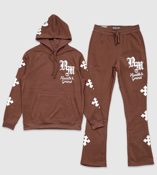 Brown hoodie and jogger set with white puzzle piece graphics, featuring 'RM Hustle & Grind' text in gothic font on the chest and thigh.