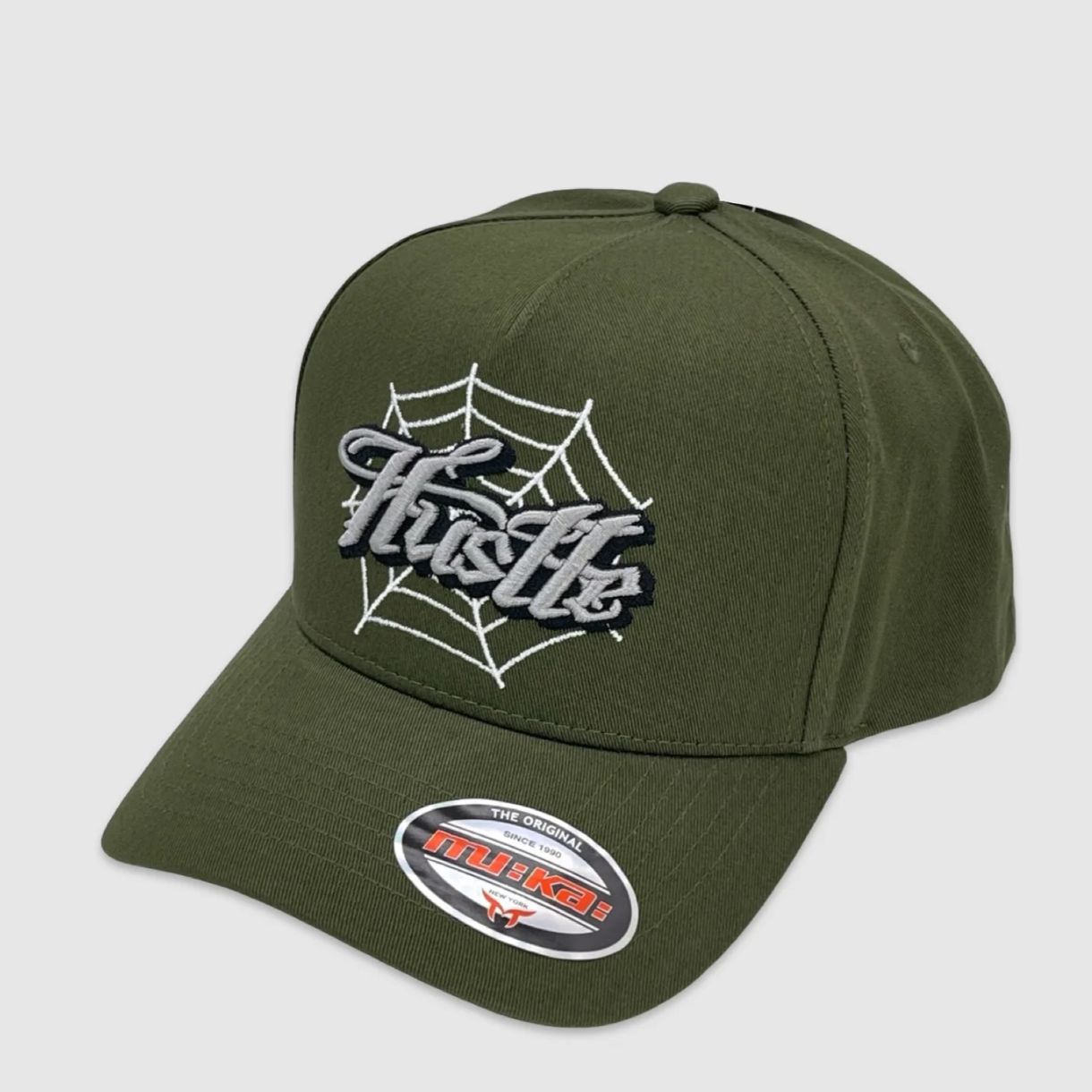 Olive green snapback hat with embroidered Hustle text and spiderweb design