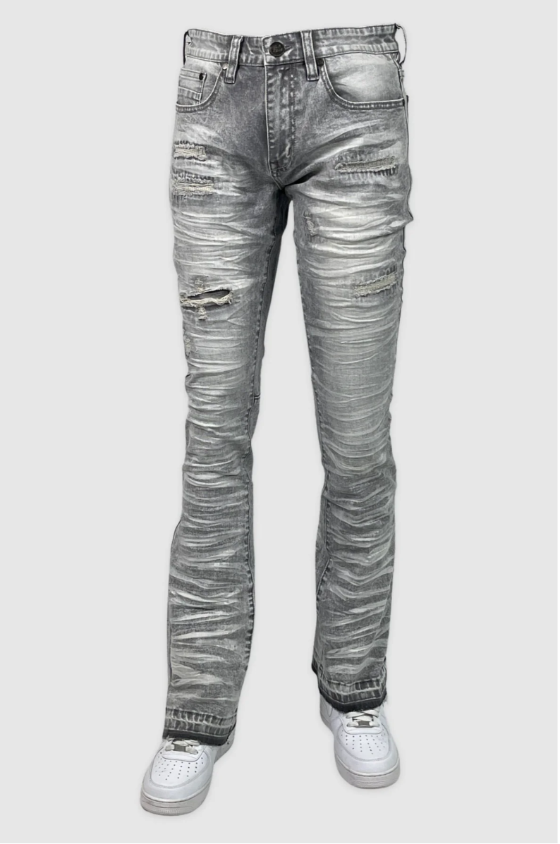 Grey stacked jeans with ripped knee and ruched leg