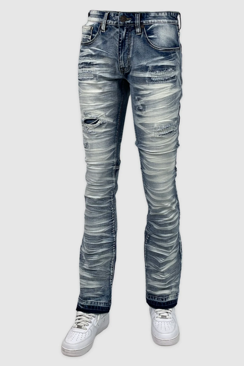 Indigo stacked jeans with ripped knee and ruched leg