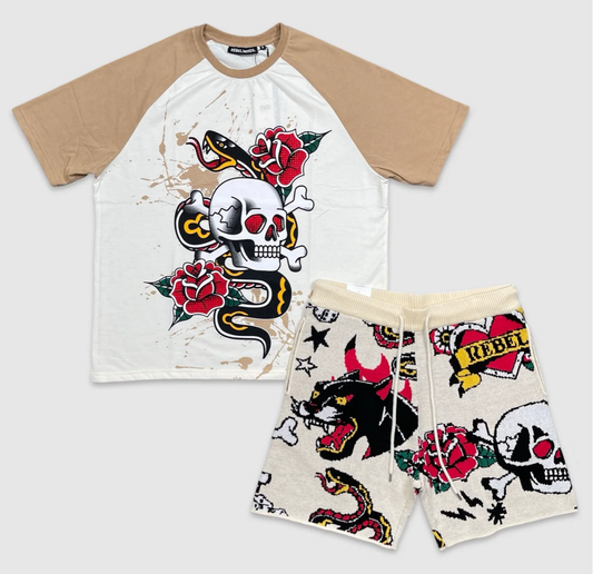Two-piece Rebel Minds outfit with beige and white graphic t-shirt featuring skull, roses, and snake design, paired with cream knit shorts decorated with panther, skull, rose, snake, and heart graphics
