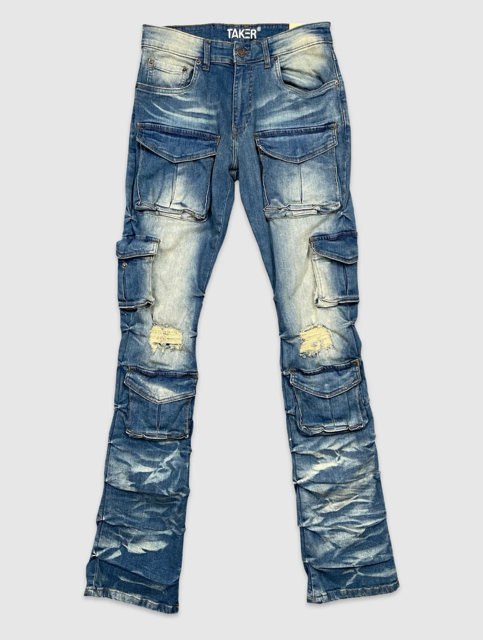 Men's dark blue stacked cargo jeans with distressed detailing and multiple utility pockets